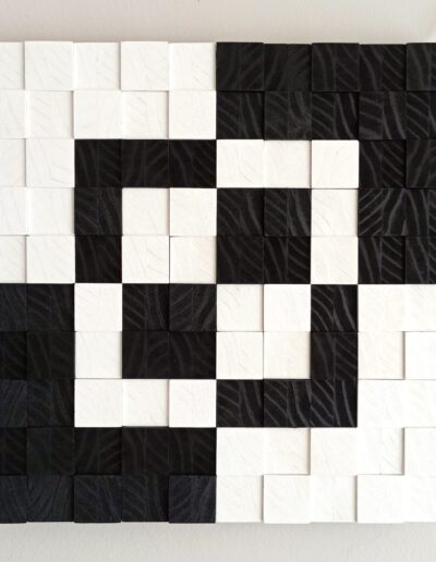 wooden wall art with minimalist modern design in black and white wooden tiles