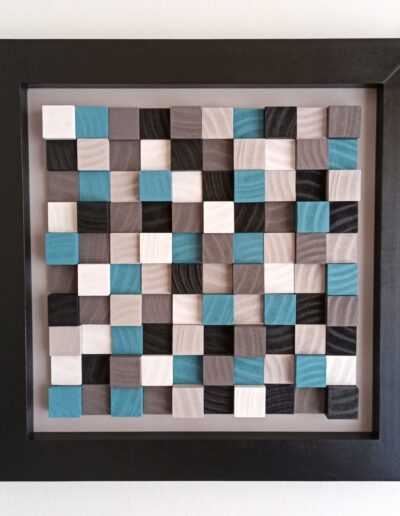 wooden wall art with minimalist modern design in black, white, blue and grey wooden tiles