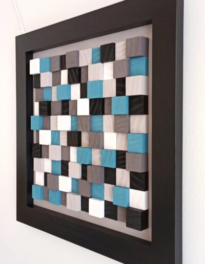 wooden wall art with minimalist modern design in black, white, blue and grey wooden tiles
